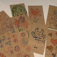 Completed lunch bags decorated by CECI faculty and staff members pile #2